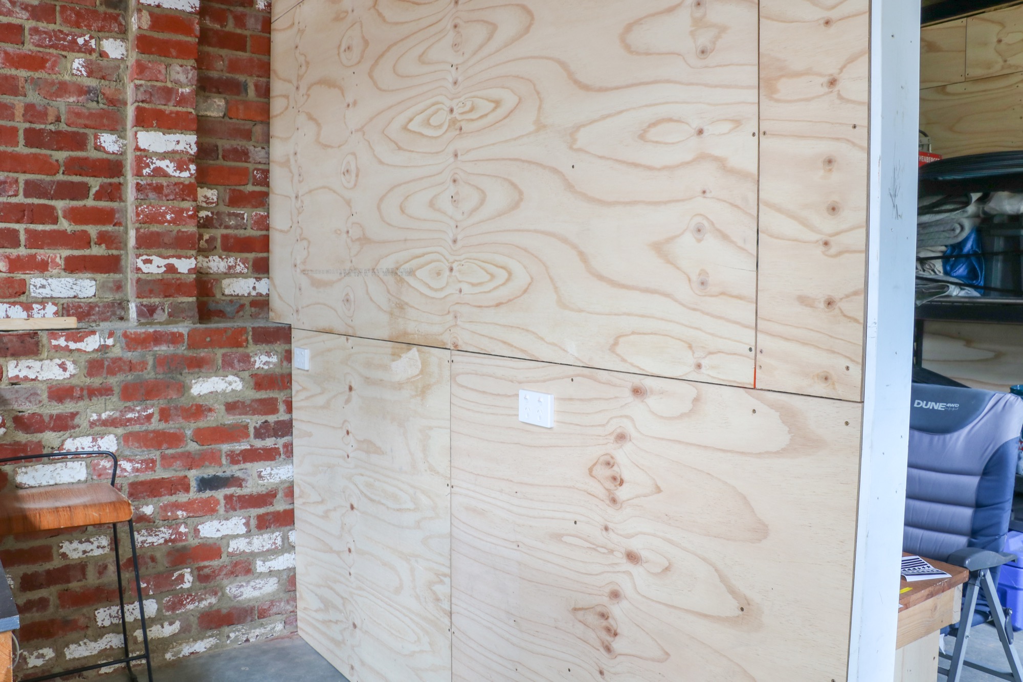 Halifax Street garage build, plywood lining against original brick